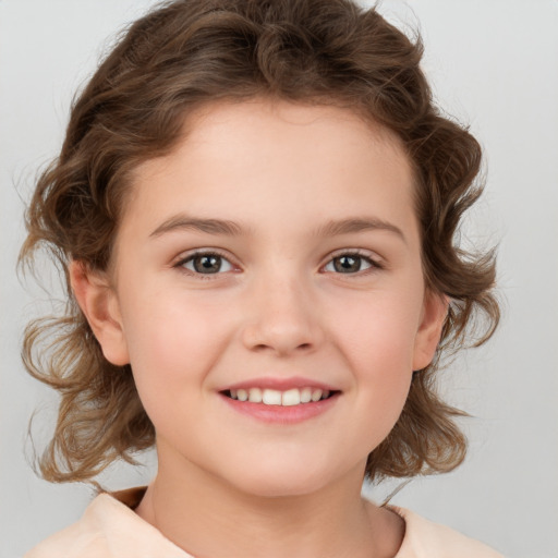 Joyful white child female with medium  brown hair and brown eyes