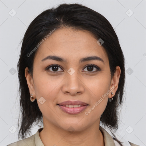 Joyful latino young-adult female with medium  brown hair and brown eyes