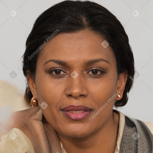 Joyful latino adult female with short  brown hair and brown eyes