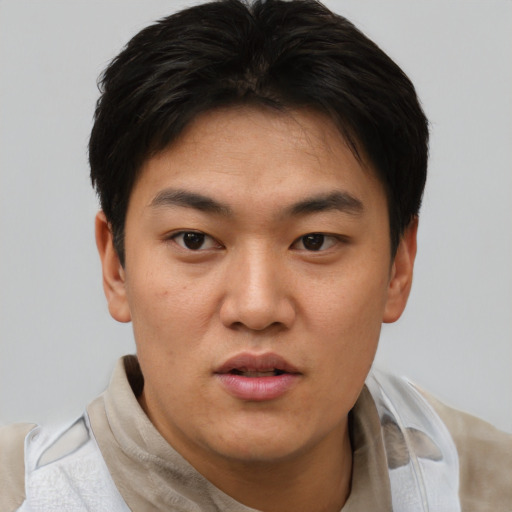 Neutral asian young-adult male with short  black hair and brown eyes