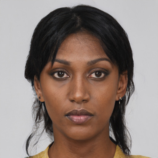 Neutral black young-adult female with medium  black hair and brown eyes