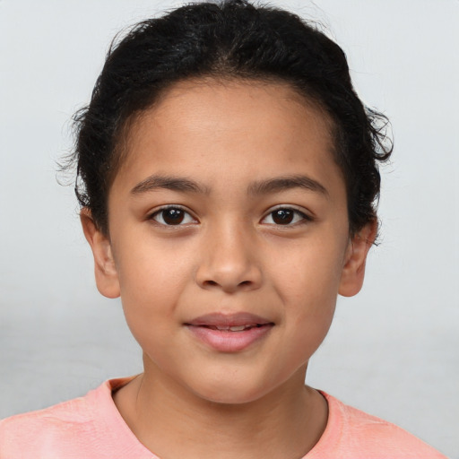 Joyful latino child female with short  brown hair and brown eyes