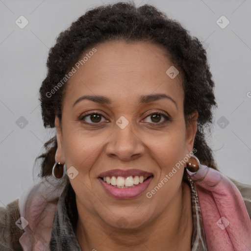 Joyful latino adult female with long  brown hair and brown eyes