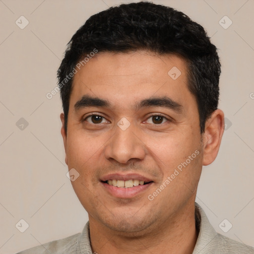 Joyful white young-adult male with short  black hair and brown eyes