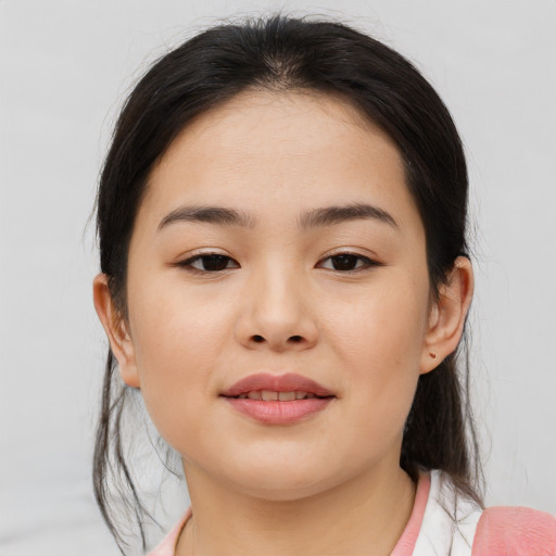 Joyful asian young-adult female with medium  brown hair and brown eyes