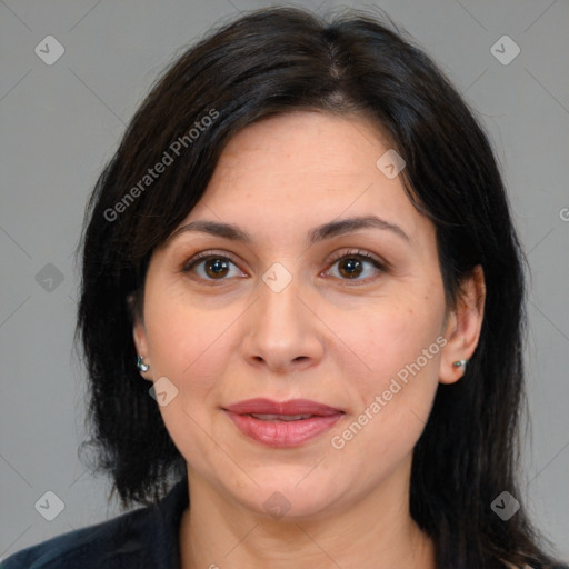 Joyful white adult female with medium  brown hair and brown eyes