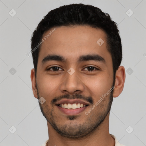 Joyful latino young-adult male with short  black hair and brown eyes