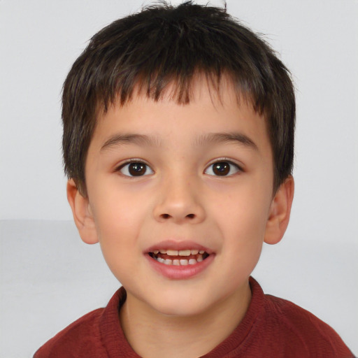 Joyful white child male with short  brown hair and brown eyes