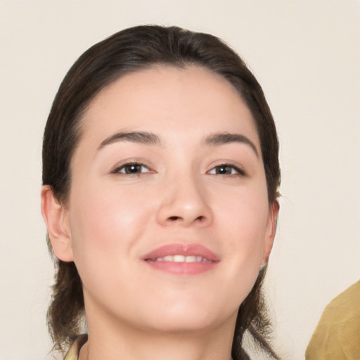 Joyful white young-adult female with medium  brown hair and brown eyes