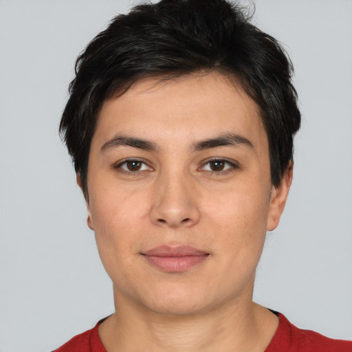 Joyful white young-adult female with short  black hair and brown eyes