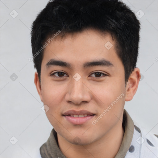 Joyful asian young-adult male with short  black hair and brown eyes