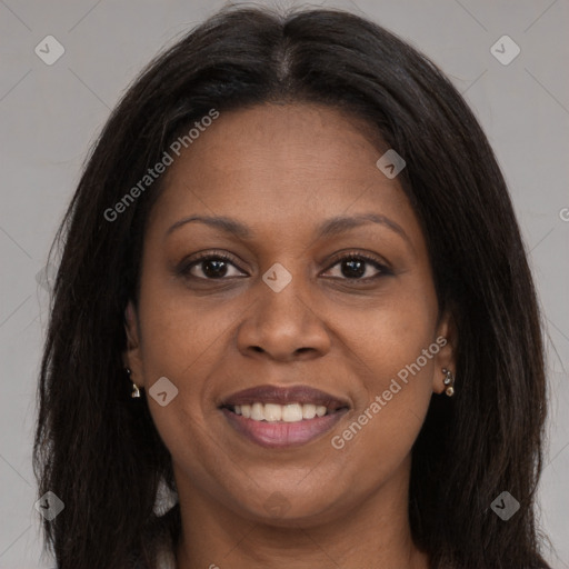 Joyful black young-adult female with long  brown hair and brown eyes