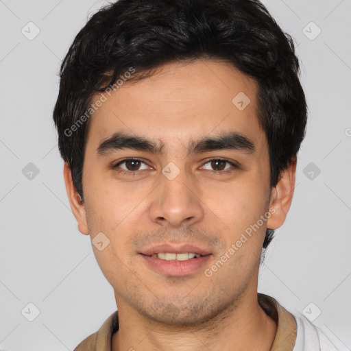 Joyful white young-adult male with short  black hair and brown eyes