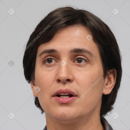 Joyful white adult female with medium  brown hair and brown eyes