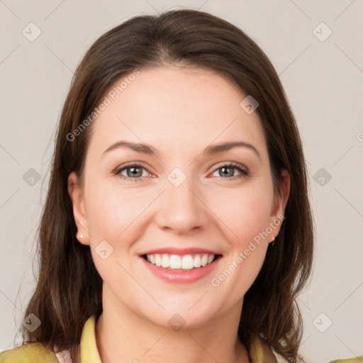 Joyful white young-adult female with medium  brown hair and grey eyes