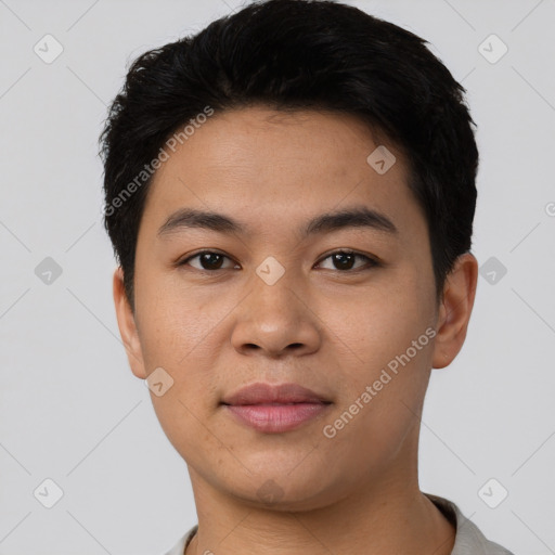 Joyful latino young-adult male with short  black hair and brown eyes