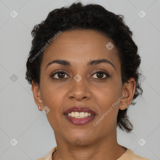 Joyful black young-adult female with short  brown hair and brown eyes