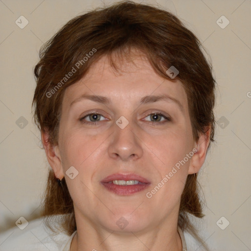 Joyful white adult female with medium  brown hair and brown eyes