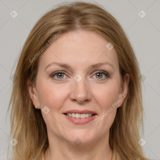 Joyful white adult female with medium  brown hair and grey eyes