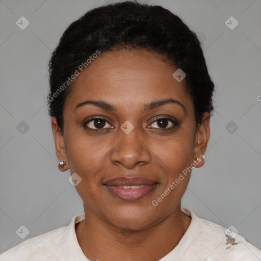 Joyful black young-adult female with short  black hair and brown eyes