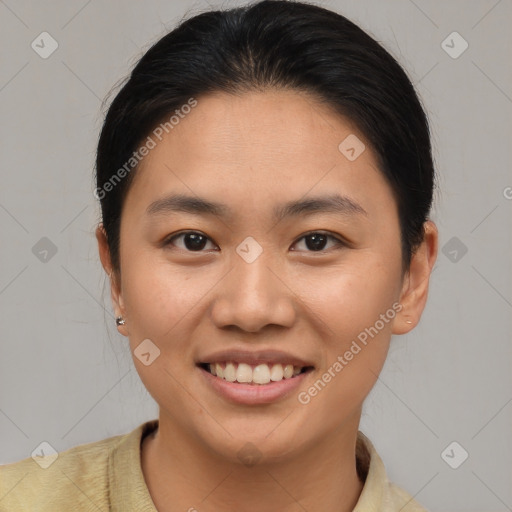 Joyful asian young-adult female with short  brown hair and brown eyes