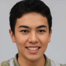 Joyful latino young-adult male with short  brown hair and brown eyes