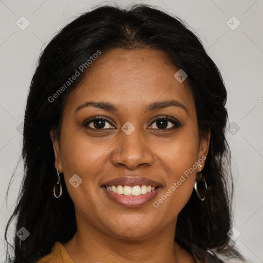 Joyful black young-adult female with long  brown hair and brown eyes