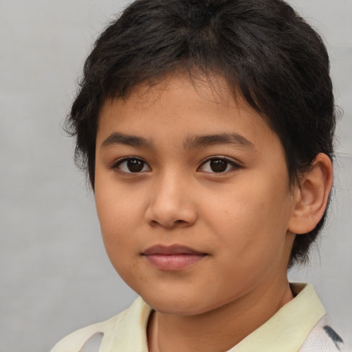 Joyful asian child female with medium  brown hair and brown eyes