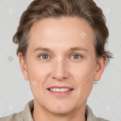 Joyful white adult male with short  brown hair and grey eyes