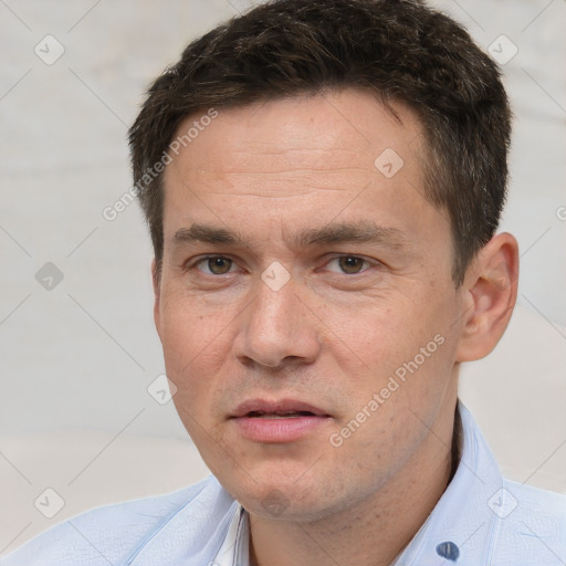 Joyful white adult male with short  brown hair and brown eyes