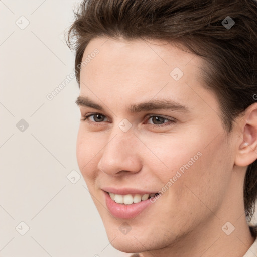 Joyful white young-adult male with medium  brown hair and brown eyes