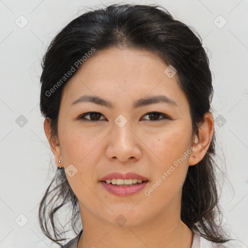 Joyful asian young-adult female with medium  brown hair and brown eyes