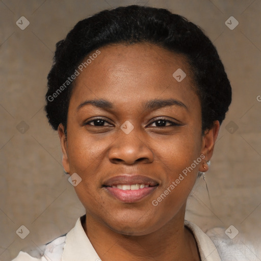 Joyful black young-adult female with short  black hair and brown eyes