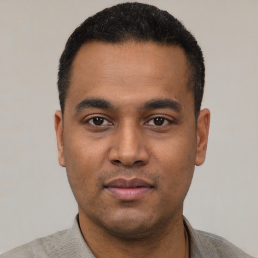 Neutral latino young-adult male with short  black hair and brown eyes