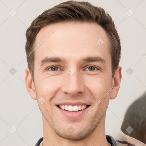 Joyful white young-adult male with short  brown hair and brown eyes