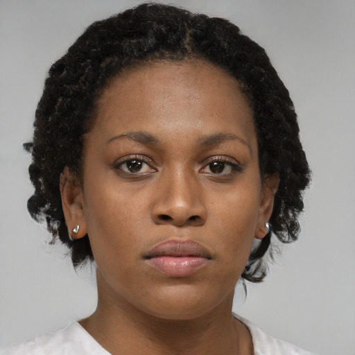 Neutral black young-adult female with short  brown hair and brown eyes