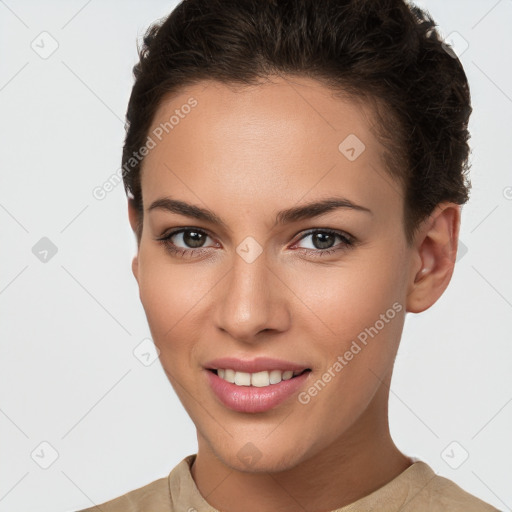 Joyful white young-adult female with short  brown hair and brown eyes