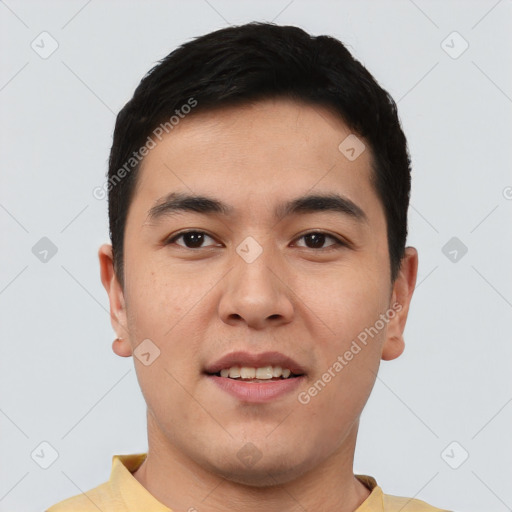 Joyful asian young-adult male with short  brown hair and brown eyes
