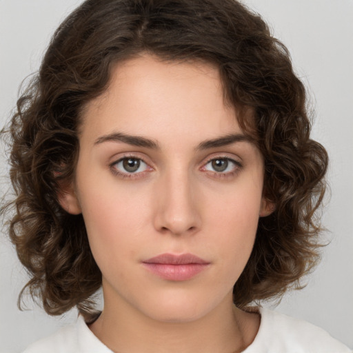 Neutral white young-adult female with medium  brown hair and brown eyes