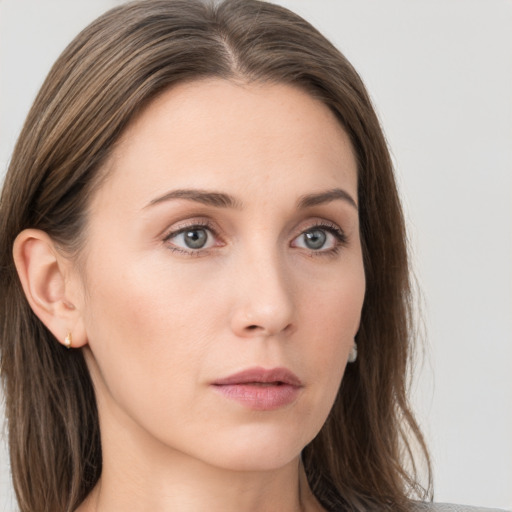 Neutral white young-adult female with long  brown hair and grey eyes