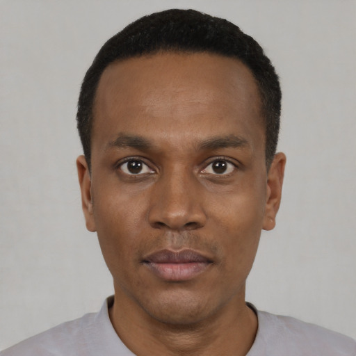 Neutral black young-adult male with short  black hair and brown eyes