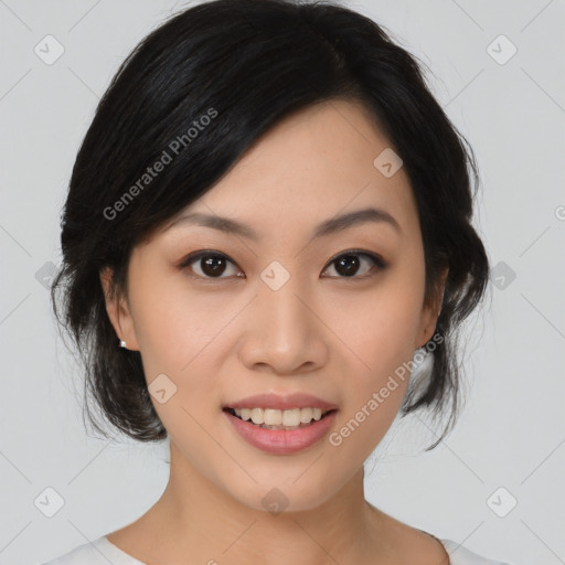 Joyful asian young-adult female with medium  black hair and brown eyes