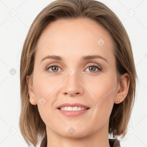 Joyful white young-adult female with medium  brown hair and grey eyes