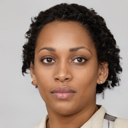 Neutral black young-adult female with short  black hair and brown eyes