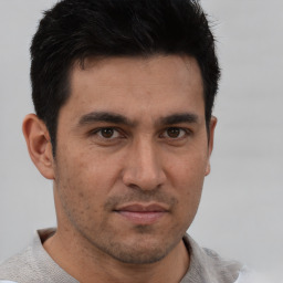 Neutral white adult male with short  black hair and brown eyes