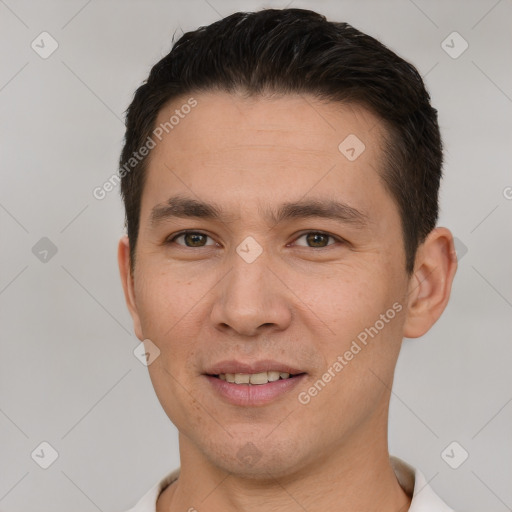 Joyful white young-adult male with short  brown hair and brown eyes