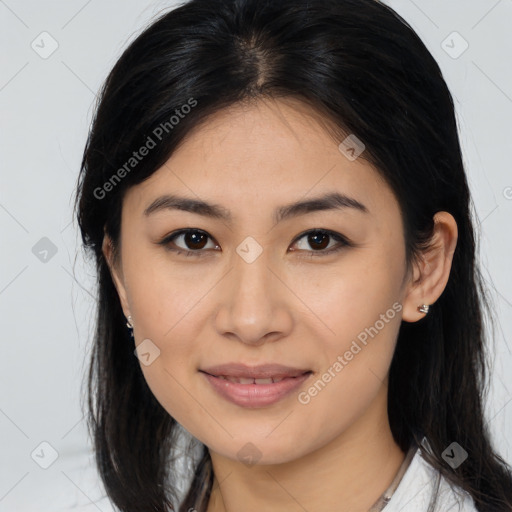 Joyful latino young-adult female with medium  brown hair and brown eyes