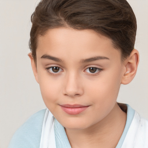 Joyful white child female with short  brown hair and brown eyes