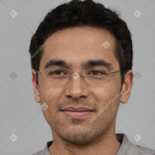 Joyful white adult male with short  black hair and brown eyes