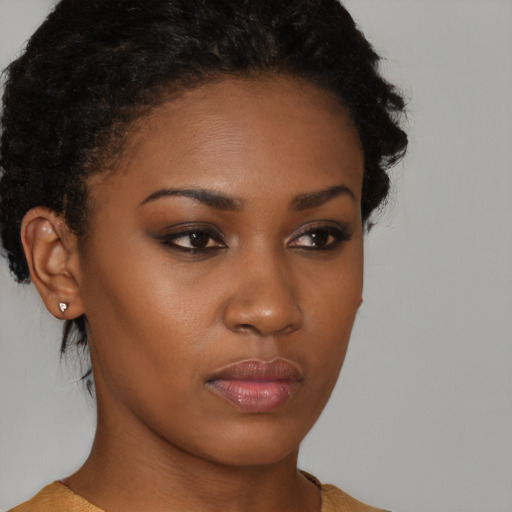 Neutral black young-adult female with short  brown hair and brown eyes